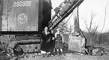 Coal miner's wives with mining machinery in Missouri 1925