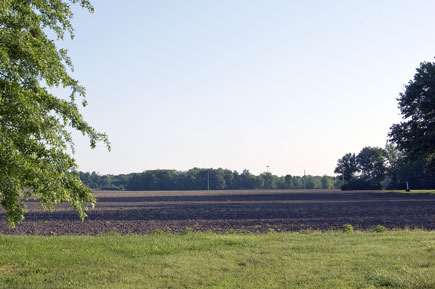 Deck's Prairie Illinois farm view from South end in 2007. Childrens toys for my solo baseball practice. 50s childhood memories of forests creeks and ponds were founded on Decks Prairie at the 19th century family farm