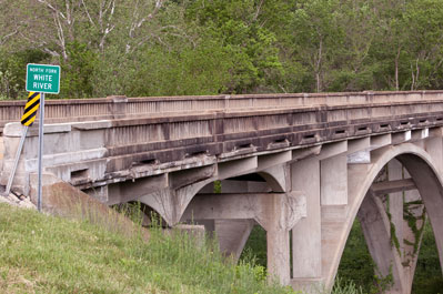 Idyllic campsite on the White River Missouri Ozarks site of my 1947 camping trip establishes lifelong threads for 50s family fishing customs and memories of forests creeks and ponds