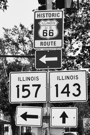 These highways connected generations of extended families from Alton Illinois to Highland Illinois the sign at this intersection frames many 50s childhood memories the store where I bought a box of 22 rifle shorts for my days target practice my grandmother's fan to mitigate the heat of summer days and the winding road through the corn fields to the dairy farm the routines for grandmothers egg money were apparent at the end of a dusty dirt road