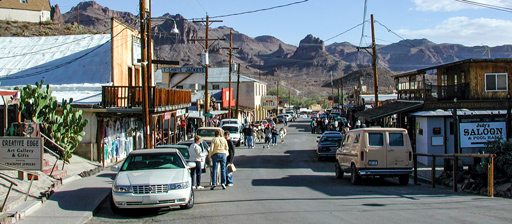 Oatman Arizona old west backroad history serves t-shirt's for tourists and carrots for feral donkeys Route 66 30s movie star hangout is 21st century destination for tourists to relive 50s childhood memories and becomes a backroad destination